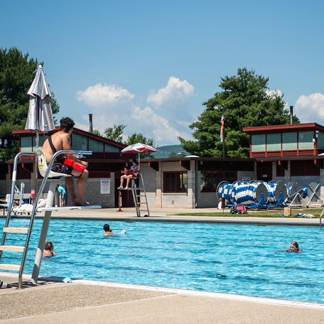 Lifeguards watch swimmers from their stands at the Ulster County Pool in July 2020.