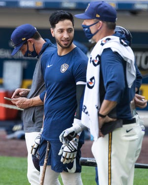 Ryan Braun, center, takes part in activities Saturday at Miller Park after the Brewers invited 45 players to camp. It was the team's first practice since March when spring training was suspended.