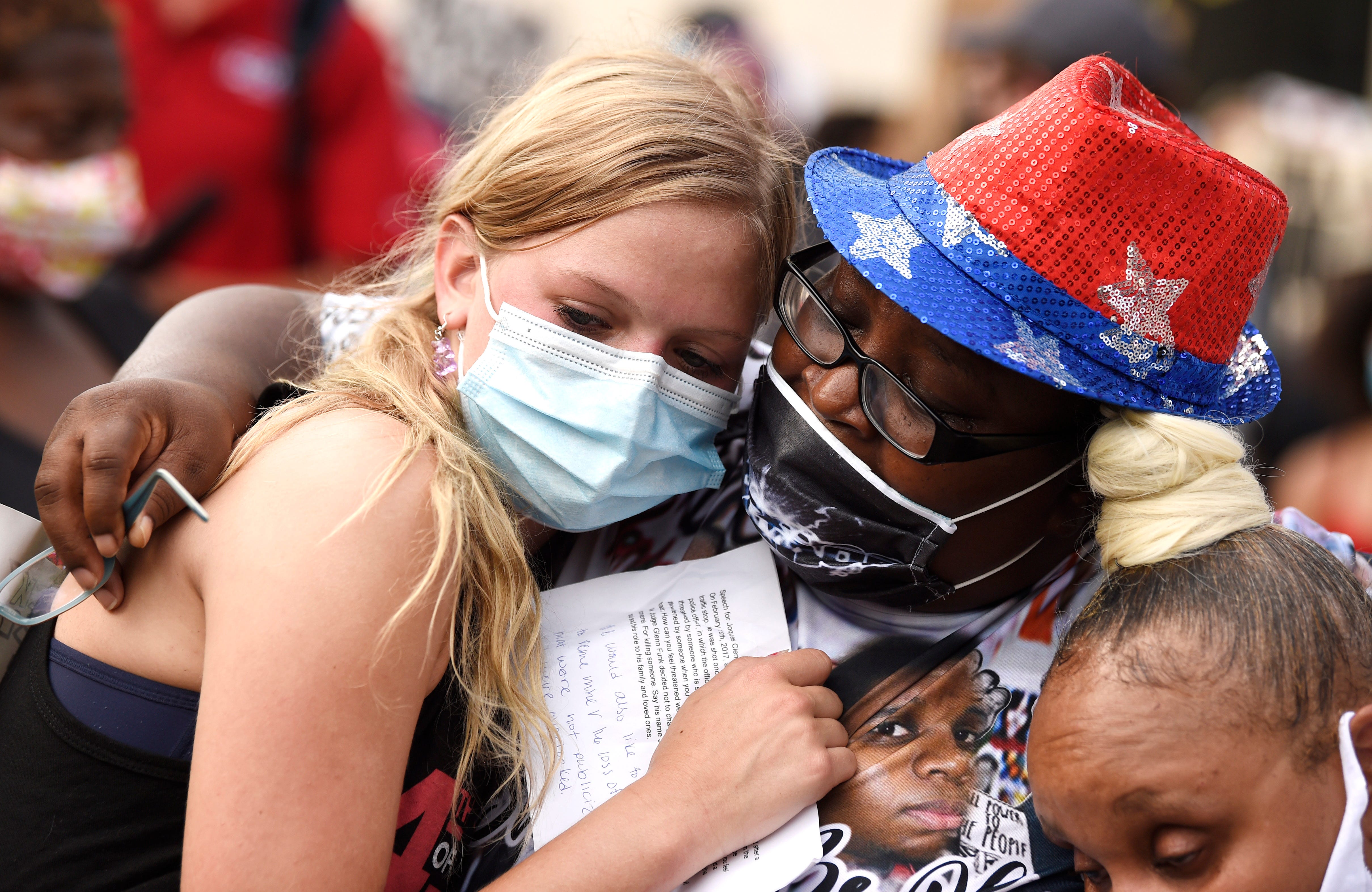 Sheila Clemmons Lee, mother of Jocques Clemmons, hugs  Emma Rose Smith, one of the leaders of Teens 4 Equality,  during the "Red, Black and Blue" protest outside Legislative Plaza in Nashville, Tenn., Saturday, July 4, 2020. Jocques Clemmons was fatally shot by Metro Police.The group Teens 4 Equality organized the rally and march.