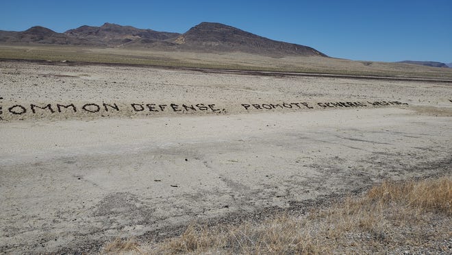 Artist Michael Dax Iacone comes back to Nevada every year to maintain the preamble to the Constitution he spelled out in rocks along Highway 50.