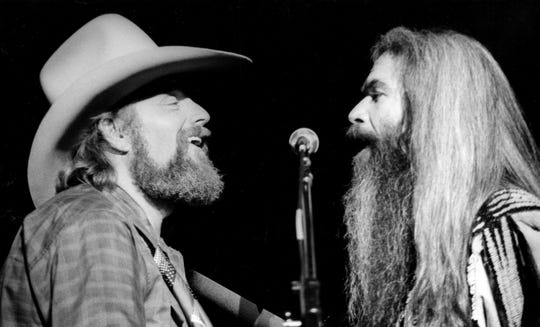 Country music stars Charlie Daniels, left, and William Lee Golden combined their talents on a stirring rendition of "How Great Thou Art," accompanied by Bobby Jones and New Life to the delight of the large crowd in attendance at Entertainment Expo '82's opening night show Nov. 12, 1982.