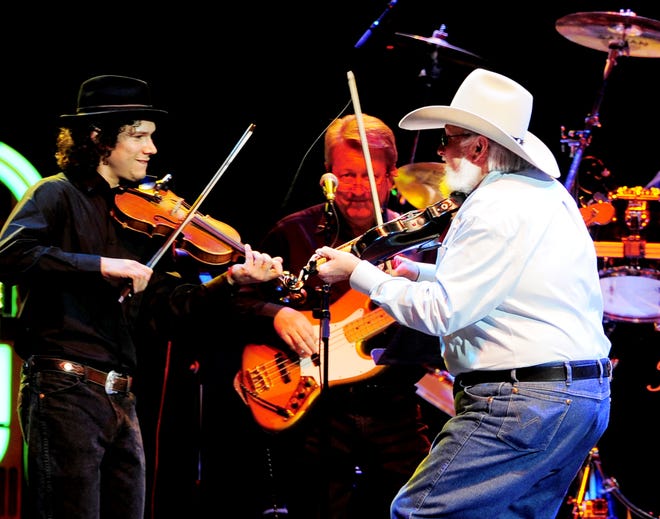 Charlie Daniels, right, plays "Me and Jesus" at the 'Playin' Possum: The Final No Show" at the Bridgestone Arena Nov. 22, 2013.