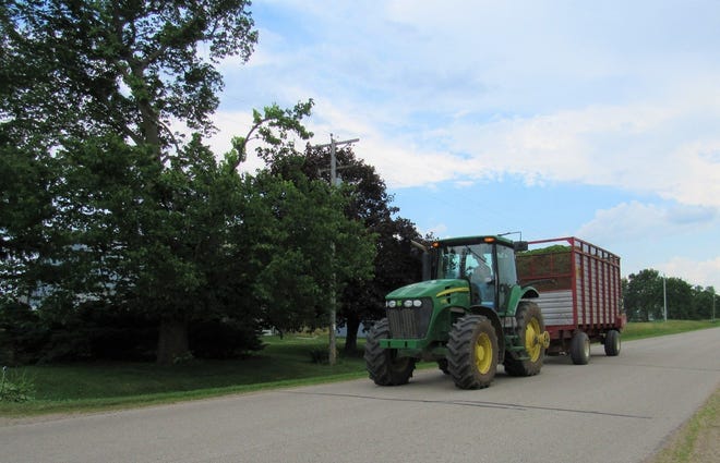 Blue sky means it’s a good time to chop hay. Susan’s a neighbors rush to beat popup showers.