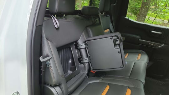 The 2020 GMC Sierra AT4 features hidden storage for clothes or a laptop behind the rear seats.
