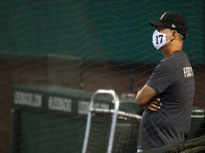 Jul 6, 2020; Phoenix, AZ, USA; Arizona Diamondbacks manager Torey Lovullo watches the instrasquad game at summer camp workouts at Chase Field. Mandatory Credit: Rob Schumacher/The Arizona Republic via USA TODAY NETWORK