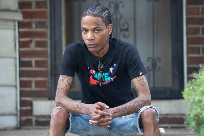 Michael Oliver, 26, poses for a photo in his neighborhood in Detroit on July 8, 2020. Last year, he was accused of reaching into a vehicle, grabbing a cell phone from a man then damaging it. Officials concluded Oliver had been misidentified as the perpetrator and dismissed the case. Detroit police used facial recognition technology in the investigation.