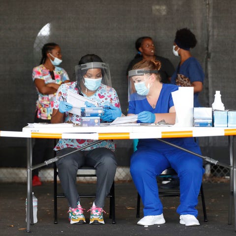 Healthcare workers Peggy Quartrman (L) and Tiffany