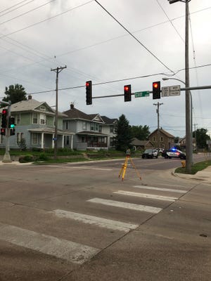Sioux Falls police close off the intersection at North Cliff Avenue and East 6th Street following a fatal crash July 9.