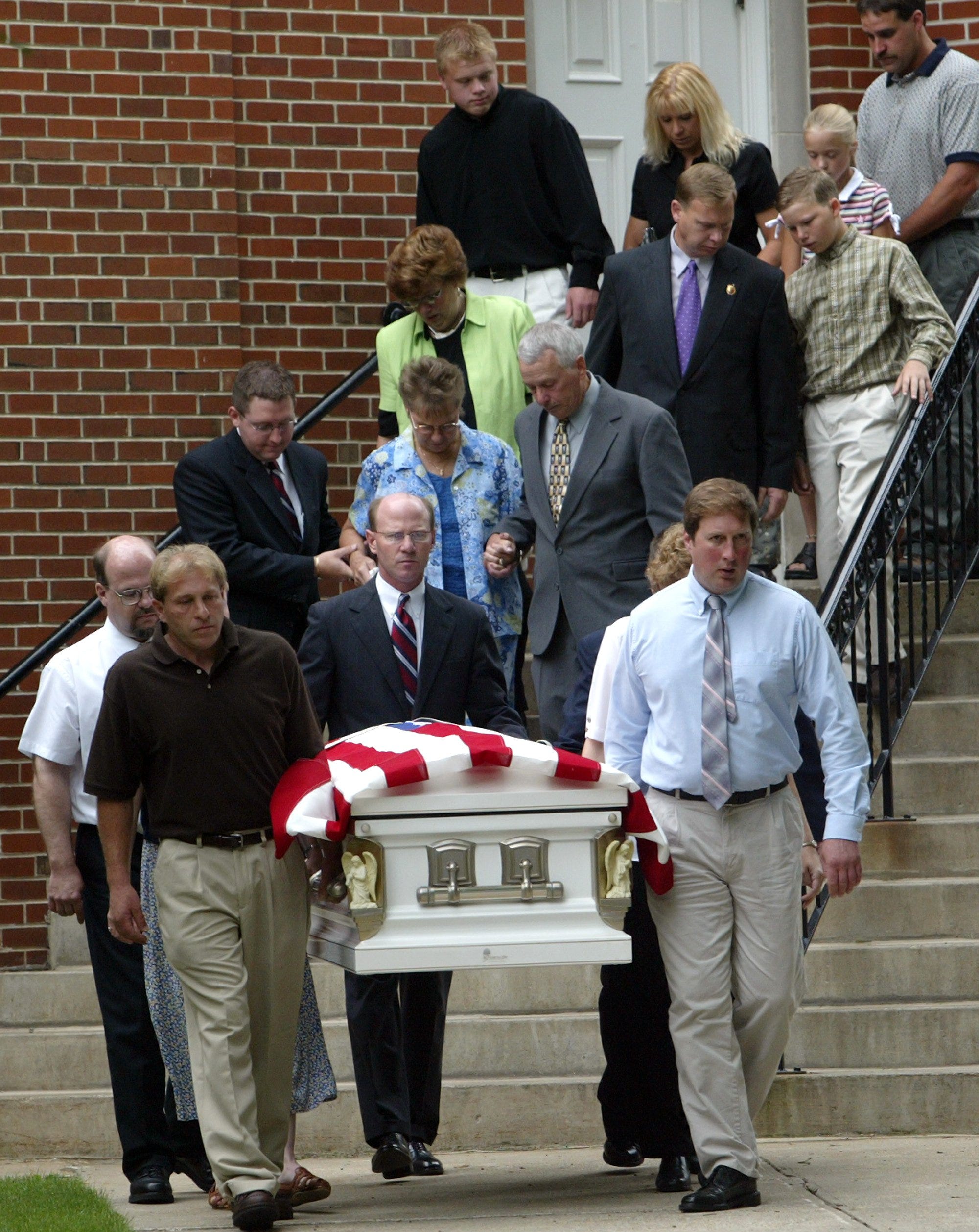 The funeral for Lori Milbrath Duncan and her daughters Kandi and Amber was held at the First United Methodist Church in Mason City. They were buried at Elmwood Cemetery in Mason City. Her mother, Marge, in blue and father, David, are behind the casket.