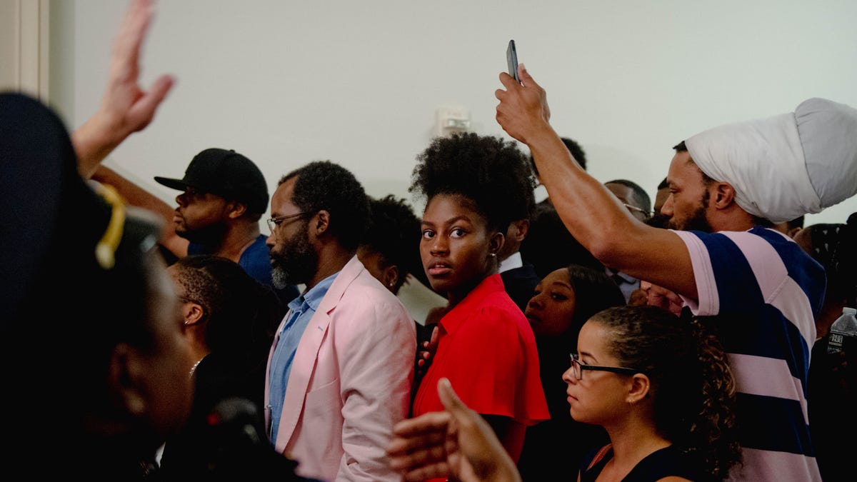 Members of the public wait in line to enter a hearing on reparations for slavery on June 19, 2019 in Washington, D.C.
