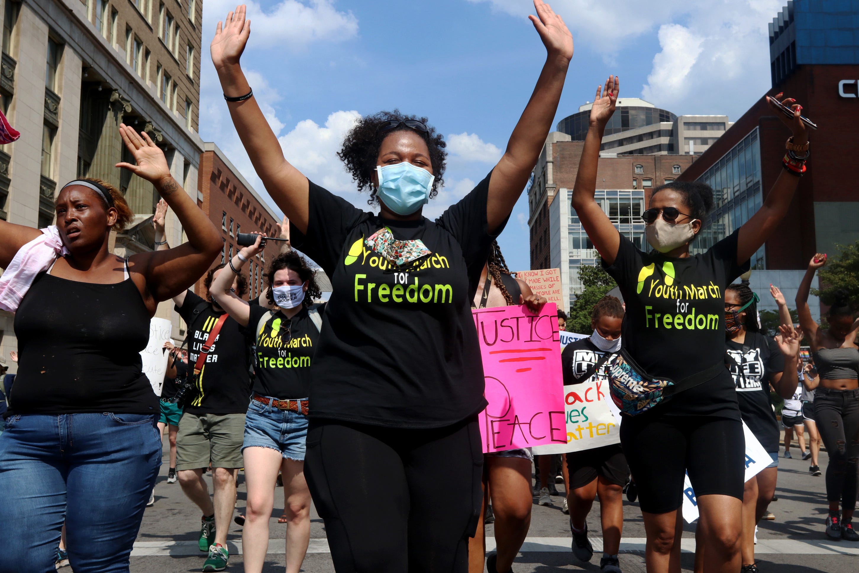 Imani Smith, 19, center, helps lead the Youth March for Freedom on July 4, 2020 in Louisville, Ky.