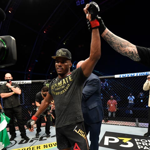 Kamaru Usman celebrates after his victory over Jor