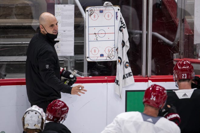 Arizona Coyotes head coach Rick Tocchet gives instructions during the first day of training camp on July 13, 2020, at Gila River Arena in Glendale, Ariz. NHL owners and players approved an agreement Friday to resume the season.