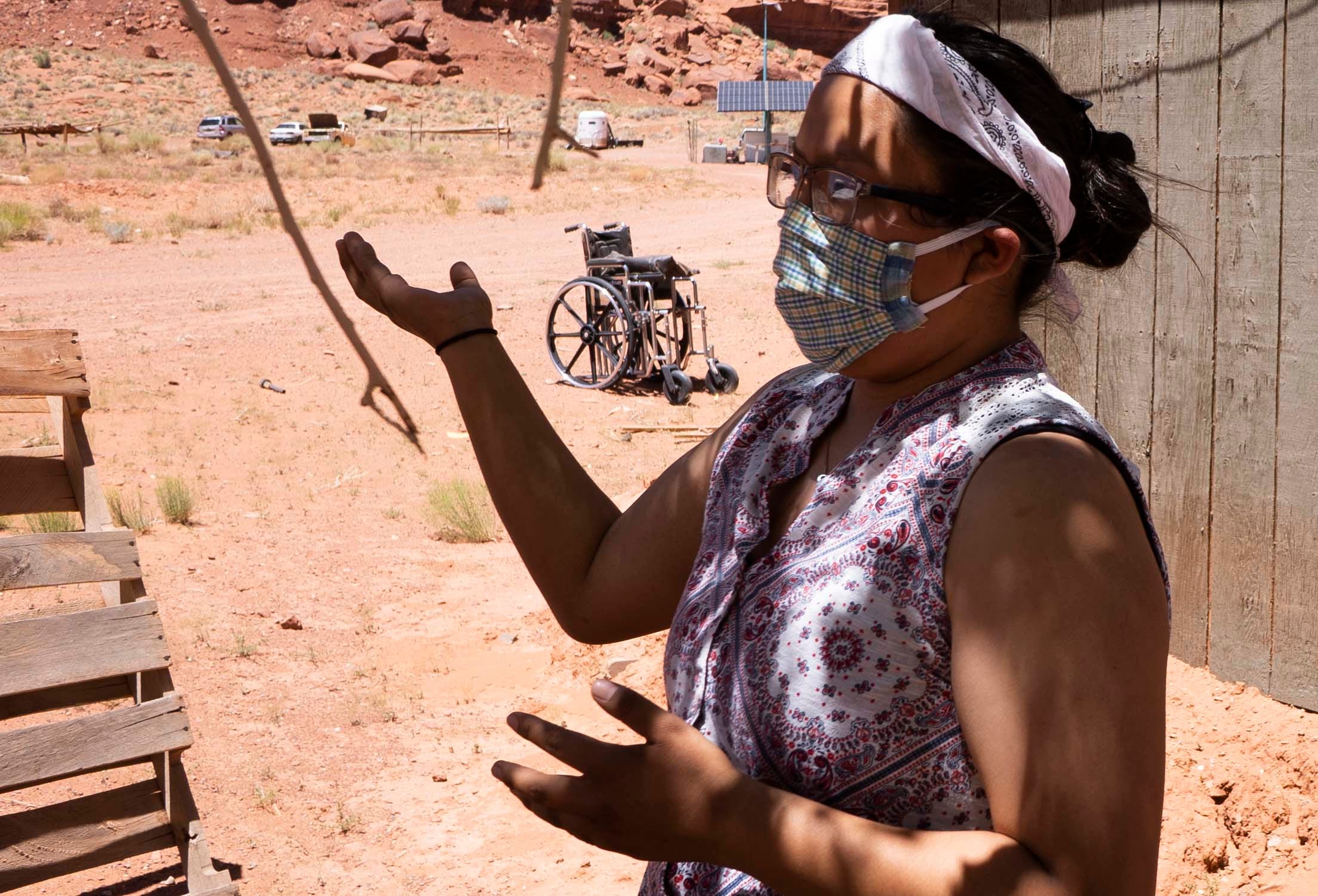 Felicia Holliday, 17, speaks about how her family gets water to their home in Monument Valley, just south of the Utah-Arizona border, on the Navajo Nation. She says she bathes her grandmother with a bucket and a washcloth. Other relatives keep the water barrels filled by making trips to a spigot to fill up.