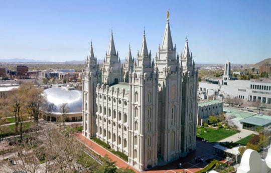 FILE - In this April 18, 2019, file photo, the Salt Lake Temple in Salt Lake City is viewed. The Church of Jesus Christ of Latter-day Saints has asked all its members in Utah to wear face coverings when in public, a request that comes as confirmed coronavirus infections in the state increase. (AP Photo/Rick Bowmer, File)
