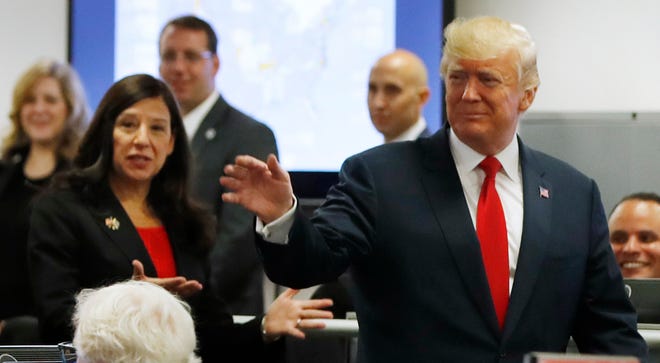 President Donald Trump tours Federal Emergency Management Agency headquarters in Washington, Aug. 4, 2017, with acting Homeland Security Secretary Elaine Duke and Vice President Mike Pence.