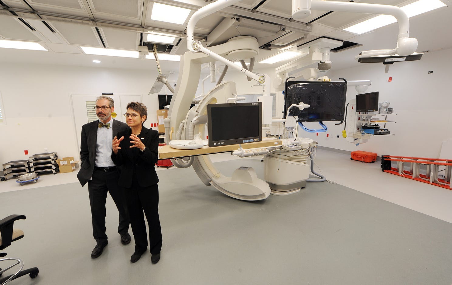 Dr. Lisa Harris and Matt Gutwein show off one of the many operating rooms at the new Eskenazi Hospital in 2013.