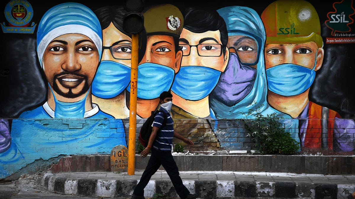 A mural salutes health workers in New Delhi. On July 14, the government eased a nationwide lockdown imposed as a preventive measure against  COVID-19.