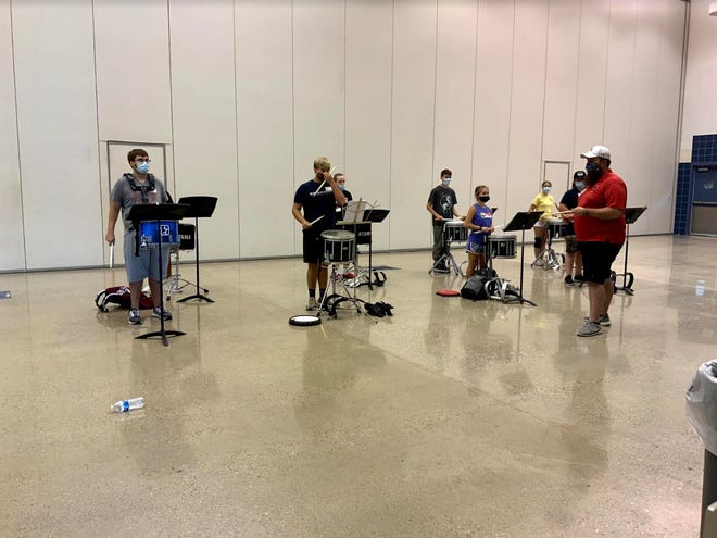 Snare drummers prepare for more exercises during the 2020 Texoma Marching Arts and Leadership Academy in Ardmore on Wednesday.