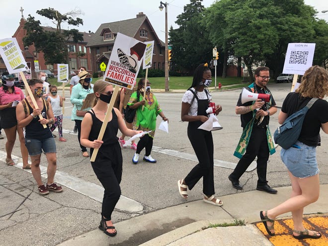 Protesters march down King Drive to We Energies offices in downtown Milwaukee to ask for an extension to the moratorium on disconnection.
