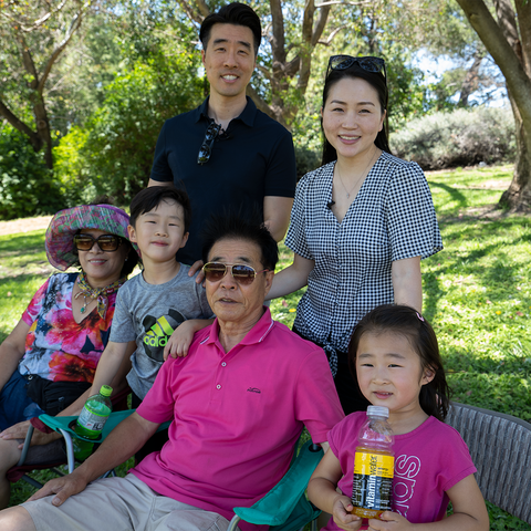 The Kim family enjoys a day together at the park.
