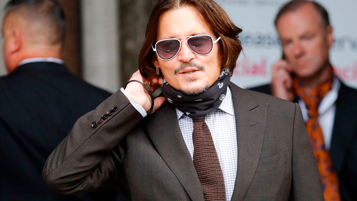 Johnny Depp arrives to attend the seven day of his libel trial against News Group Newspapers (NGN), at the High Court in London, on July 15, 2020. Depp is suing the publishers of The Sun and the author of the article for the claims that called him a "wife-beater" in April 2018.