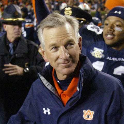 Auburn coach Tommy Tuberville leaves the field at 
