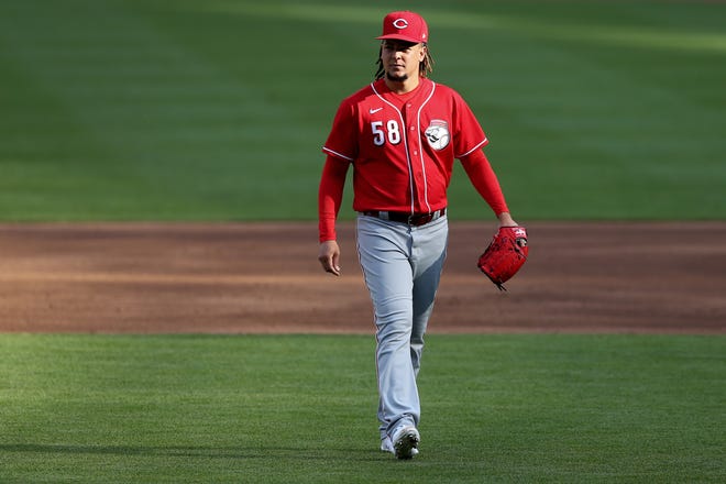 Cincinnati Reds starting pitcher Luis Castillo (58) walks back to the bound between batters during an intrasquad scrimmage, Wednesday, July 15, 2020, at Great American Ball Park in Cincinnati.