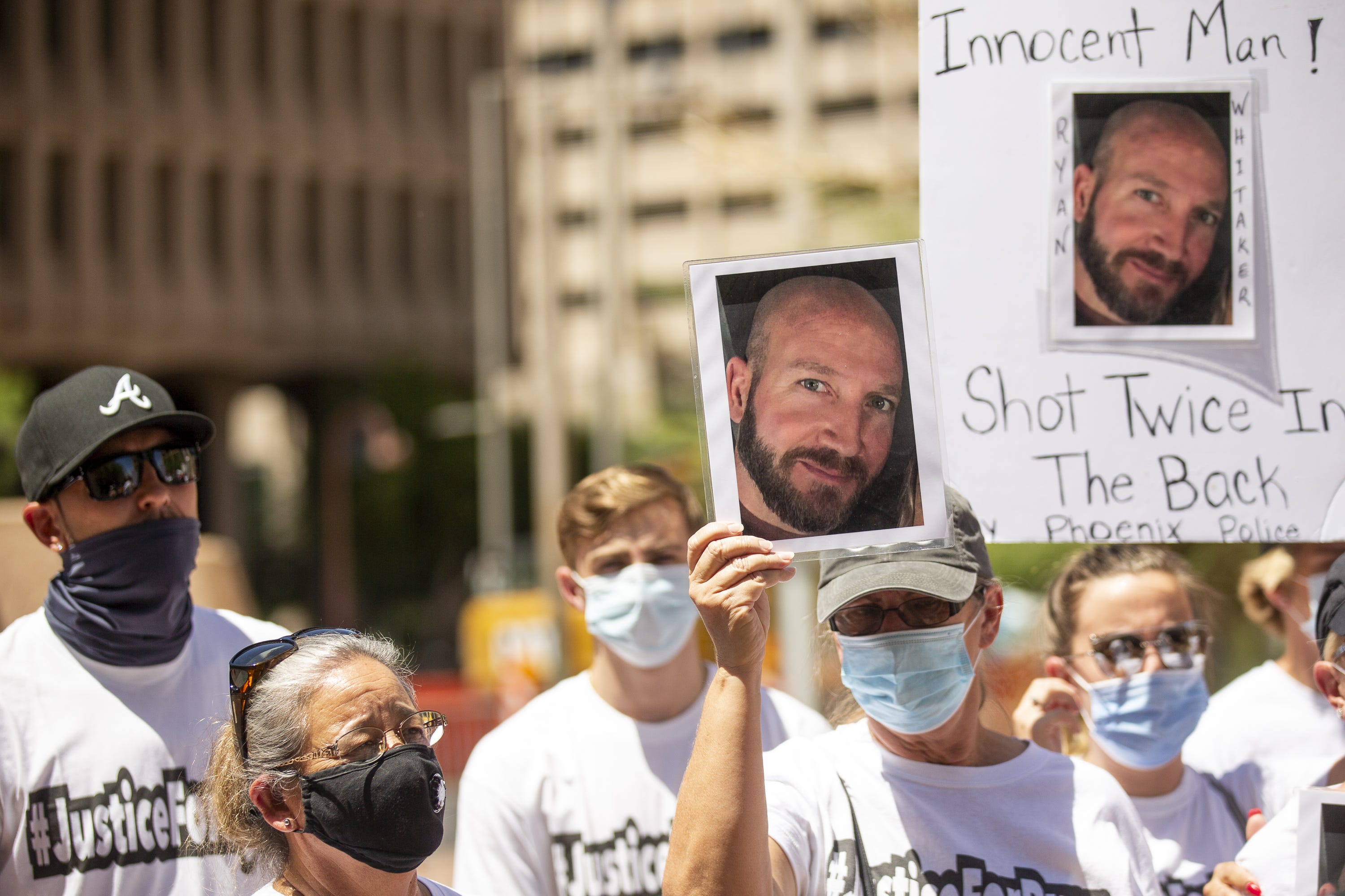 Family and friends of Ryan Whitaker hold a press conference outside Phoenix City Hall on July 16, 2020.