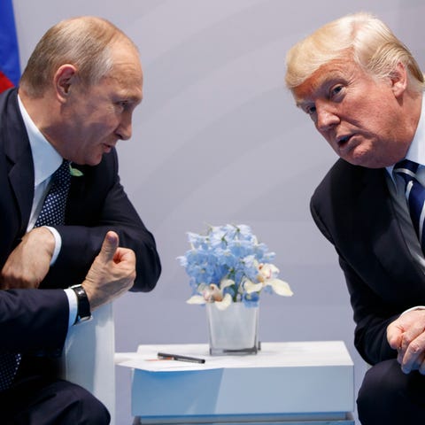 President Donald Trump, right, meets with Russian 