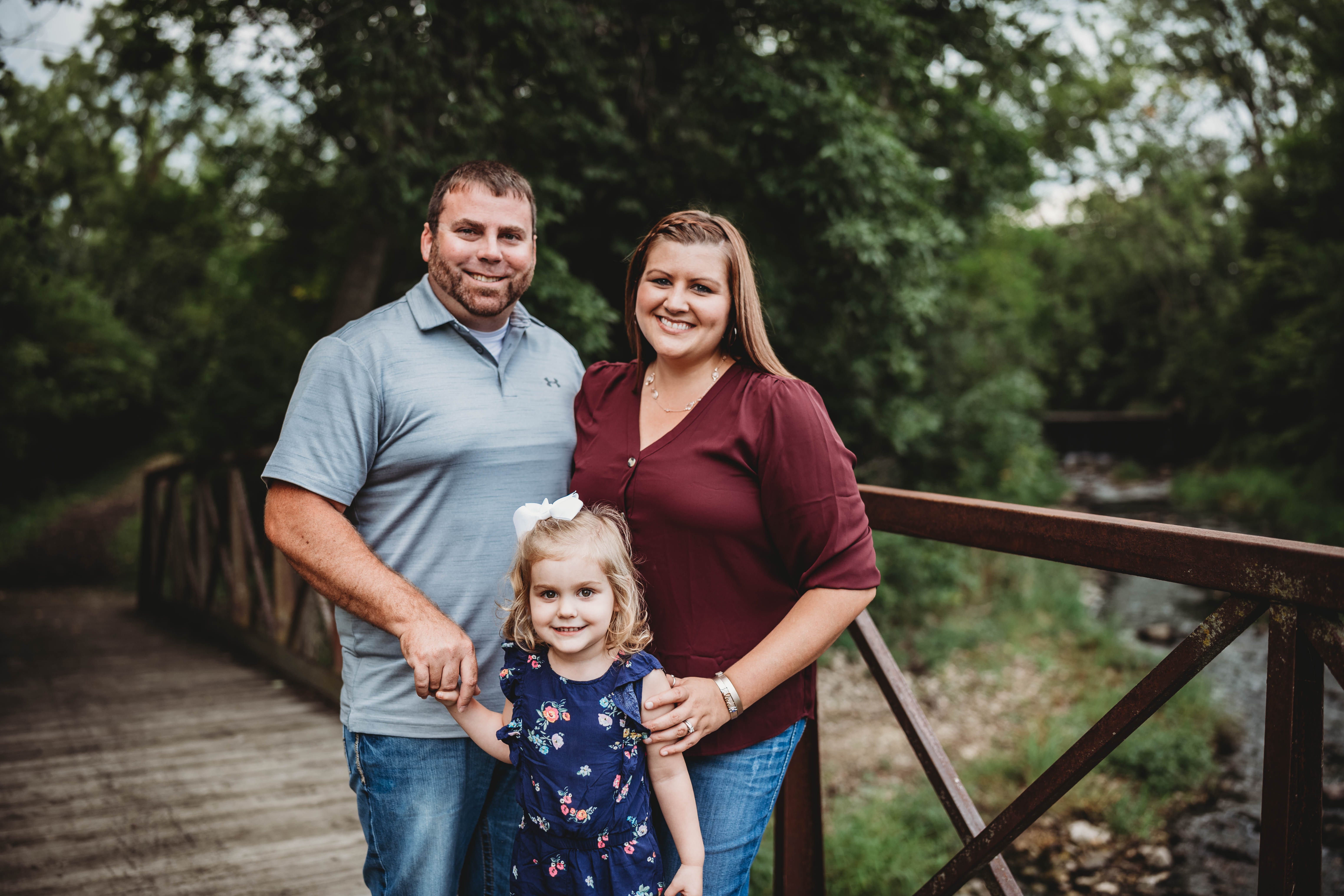 Alecia Young, at right, poses with her family. The couple's daughter, Tinley, 3, has been back at daycare since mid-May. She has adjusted well to the various protocols put in place to mitigate the spread of coronavirus.