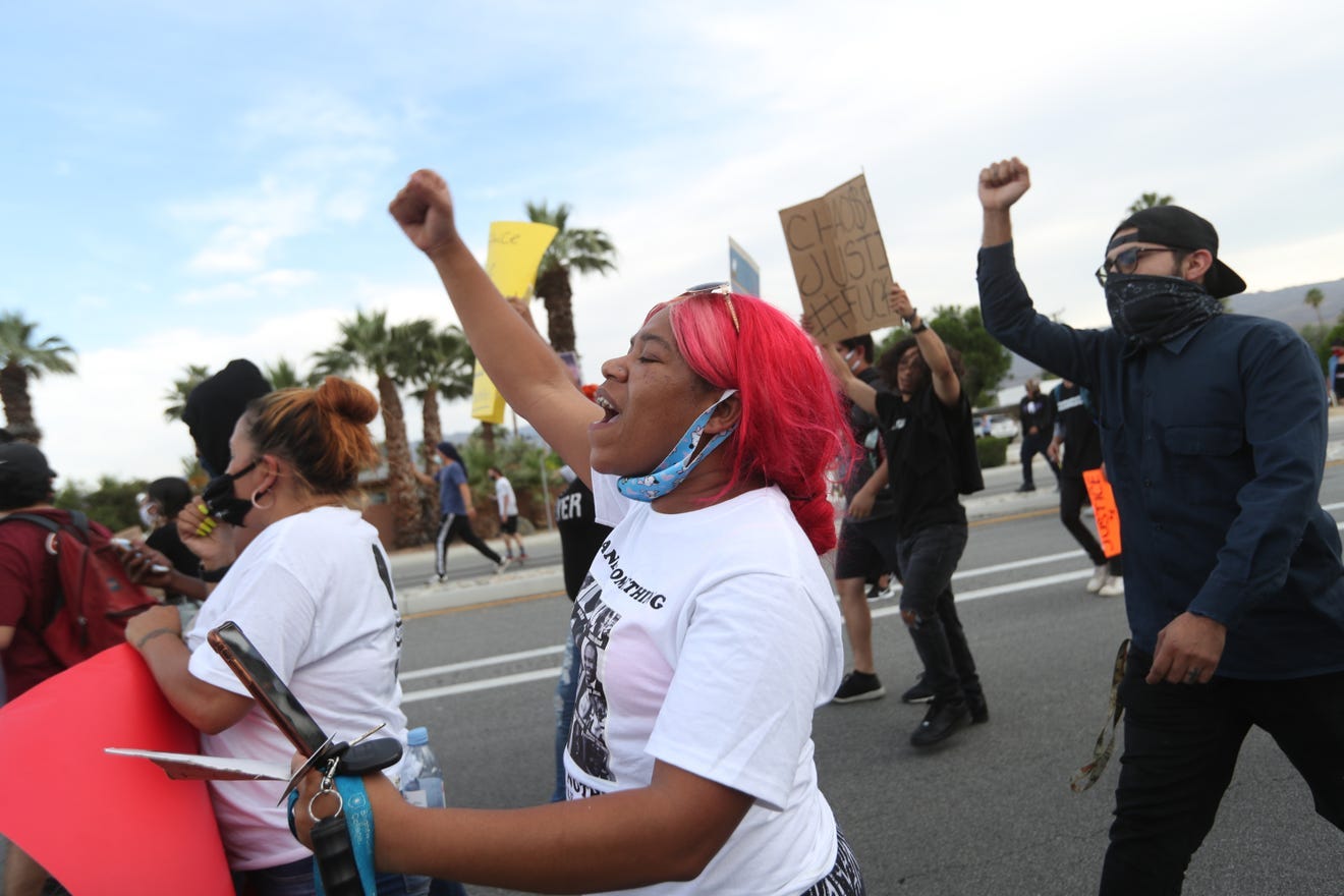 Nicole Smith of La Quinta marches in Palm Desert, California, on June 1 as part of the nationwide civil unrest following the death of George Floyd. Taya Gray/The Desert Sun