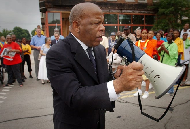 Congressman John Lewis led a march called the "Walk the Walk to Live the Dream" on King Drive in Milwaukee on July 27, 2002. Lewis died Friday. He was 80 years old.