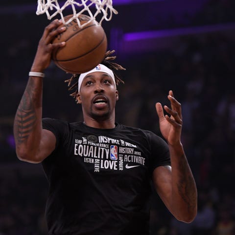 Dwight Howard warms up before a February game agai