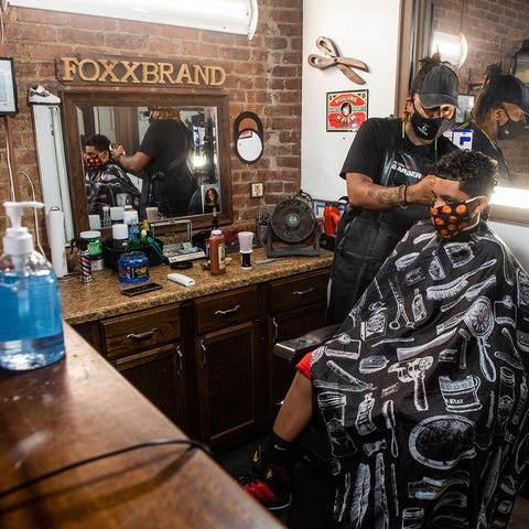 Owner of 6 West Barbershop and barber Fred William