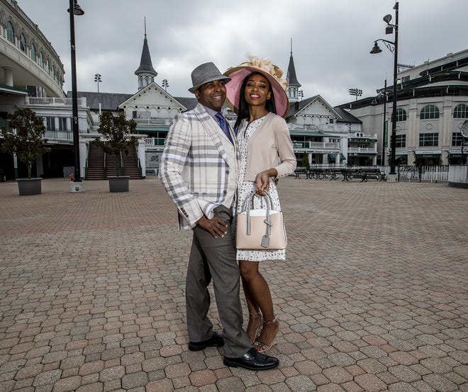 Derrick Clarkson shares a smile in a plaid linen sportcoat, taupe trousers, ivory linen vest, lavender shirt, foulard tie and straw fedora; Kasi Shelton dazzles in a white over nude eyelet dress with nude shrug, nude/taupe/white bag, taupe and pink Frank Olive straw hat during a Kentucky Derby fashion shoot with stylist Jo Ross at Churchill Downs. March 11, 2020
