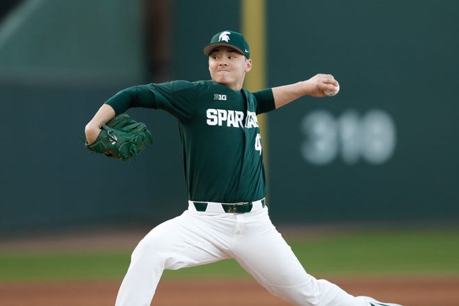 Michigan State junior pitcher Jesse Heikkinen pitches in a game against Merrimack in February. Heikkinen, a Holt grad, hopes to find success this summer in the Lemonade League hosted by the Lansing Lugnuts.