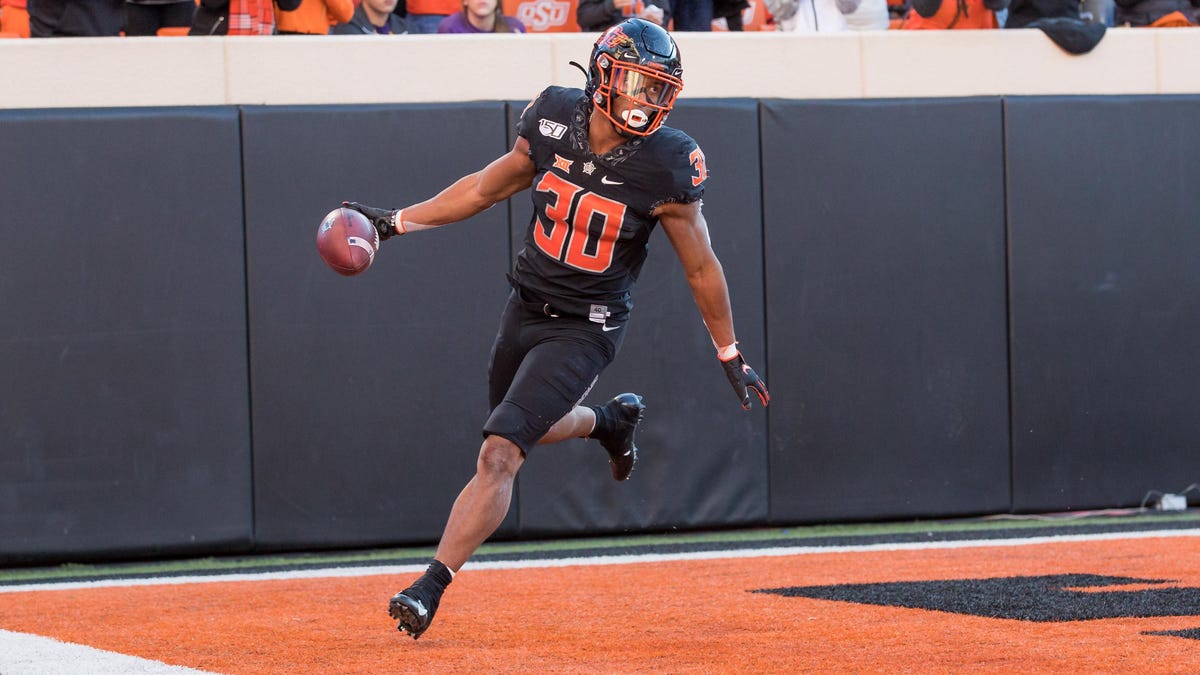 Oklahoma State Cowboys running back Chuba Hubbard celebrates a touchdown during a 2019 game against TCU at Boone Pickens Stadium in Stillwater.
