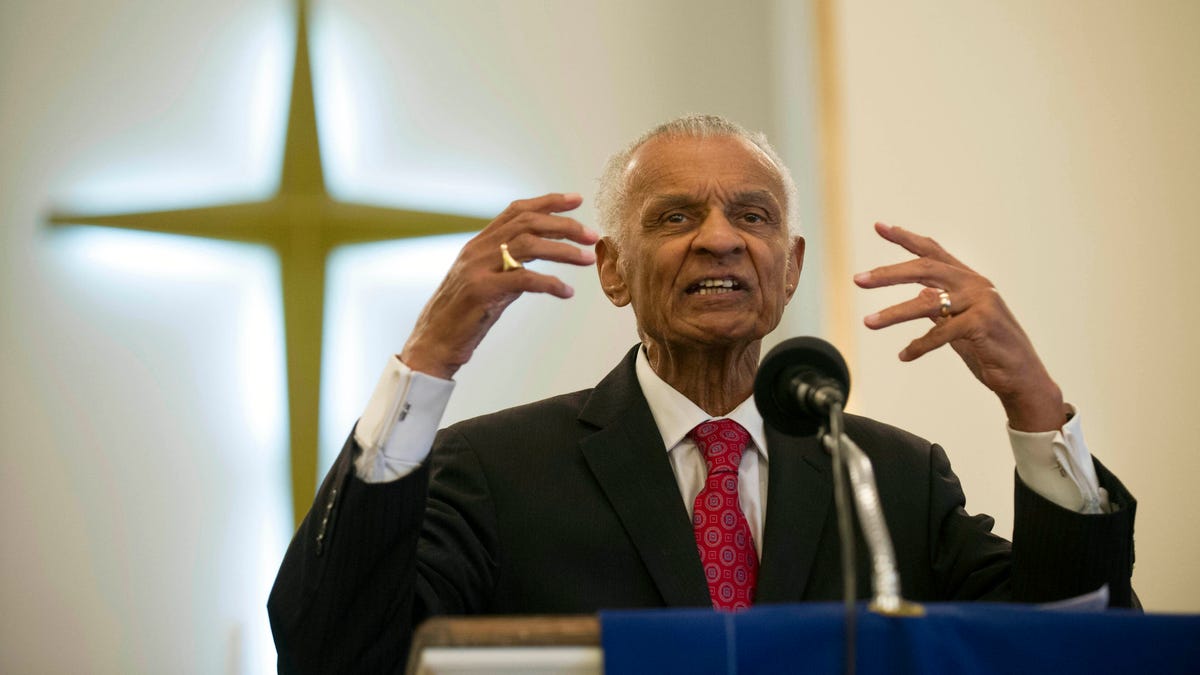 In this  June 19, 2014, file photo, Civil Rights pioneer Rev. C.T. Vivian preaches during a commemoration of the 50th anniversary of the Civil Rights Act in Knoxville, Tenn. The Rev. C.T. Vivian, a civil rights veteran who worked alongside the Rev. Martin Luther King Jr. and served as head of the organization co-founded by the civil rights icon, has died at home in Atlanta of natural causes Friday morning, July 17, 2020, his friend and business partner Don   Rivers confirmed to The Associated Press. Vivian was 95. 