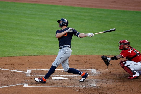 Detroit Tigers left fielder JaCoby Jones (21) follows through on a swing as he hits a two-run home run in the second inning of a preseason game between the Cincinnati Reds and the Detroit Tigers at Great American Ball Park in downtown Cincinnati on Tuesday, July 21, 2020.