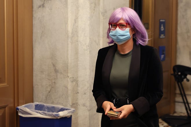 Wearing a face mask to reduce the chance of transmission of the novel coronavirus, Sen. Kyrsten Sinema arrives at the U.S. Capitol for a vote May 18, 2020, in Washington, D.C.