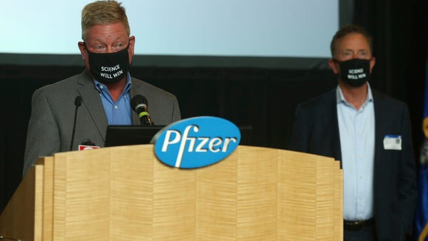 John Burkhardt, left, head of the Pfizer Groton si