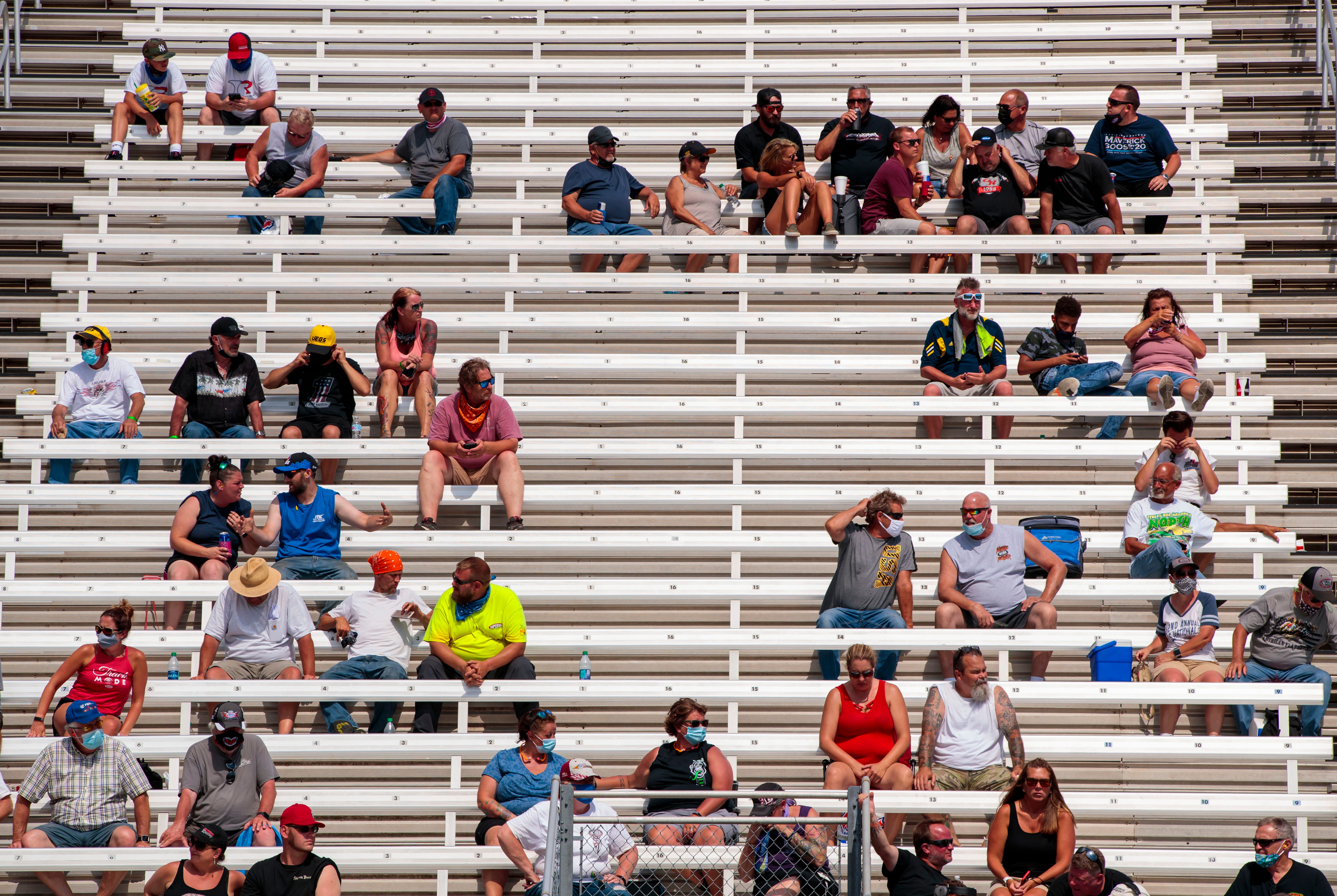 Fans keep a safe distance from one another in the grandstands July 11 in in Clermont, Indiana, as the National Hot Rod Association returned to racing.