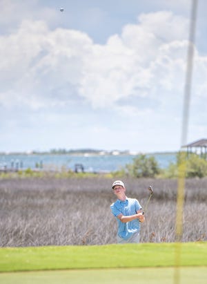 Maxwell Page chips onto the green during the First Tee of Northwest Florida's Divot Derby at the Tiger Point Golf Club in Gulf Breeze on Wednesday, July 22, 2020.