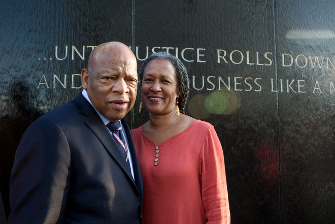 Lecia Brooks, chief of staff of the Alabama-based Southern Poverty Law Center, poses with the late congressman and civil rights pioneer, John Lewis.