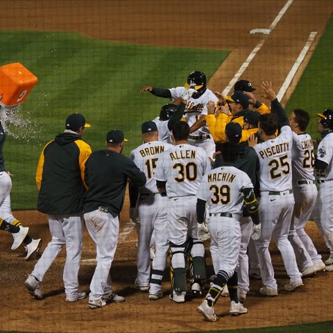Oakland players celebrate Matt Olson's walk-off gr