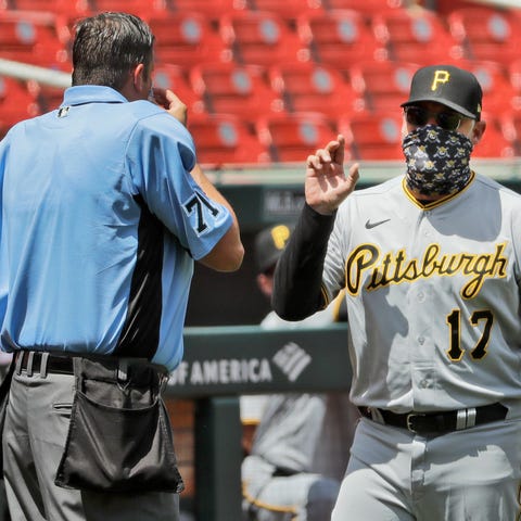 Pirates manager Derek Shelton argues with home pla