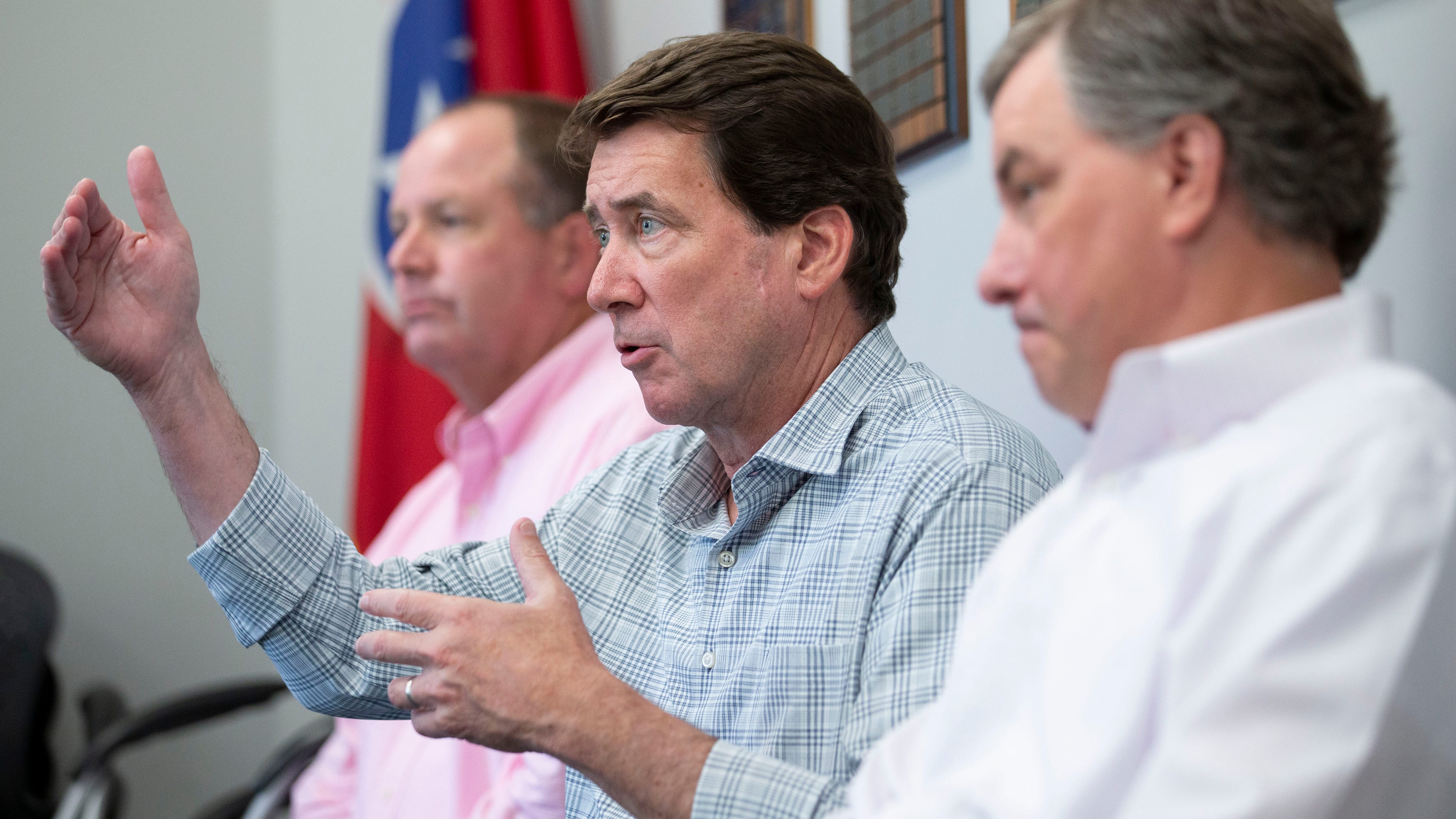 U.S. Senate candidate Bill Hagerty (center) speaks to a group while seated between State Rep. Kevin Vaughan (left) and State Rep. Ron Gant on Monday, July 27, 2020, at the West Tennessee Home Builders Association in Collierville.