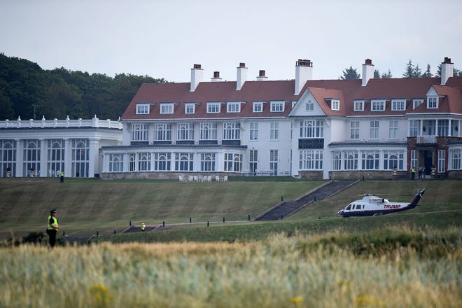 Police offficers stand guard at Trump Turnberry, the luxury golf resort of President Donald Trump, in Turnberry, southwest of Glasgow, Scotland, on July 14, 2018, during the private part of his four-day UK visit. (Andy Buchanan/AFP/Getty Images/TNS)