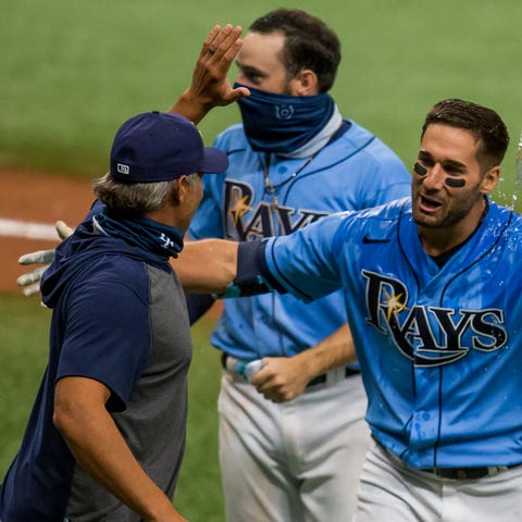 Tampa Bay Rays manager Kevin Cash, left, celebrate